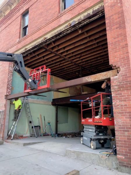 Placing the massive steel beam over the storefront