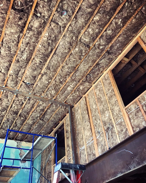 Insulating the storefront and manager's suite