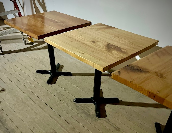 Three square cafe tables made from salvaged old growth fir.